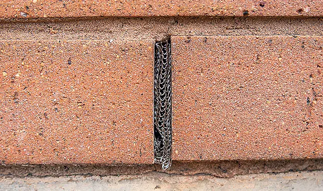 Flexi armour applied to a thin crack in a brick wall