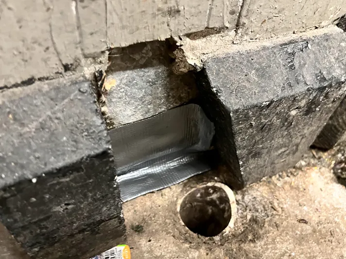 Flexi armour high grade sealant tape applied to a crack in foundation