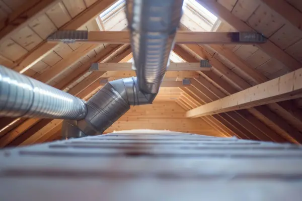 Metal piping in the attic of a home